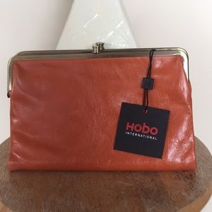 Hobo “Leanne” crossbody clutch in pumpkin